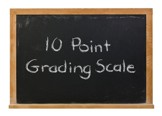 Obraz premium Ten point grading scale written in white chalk on a black chalkboard isolated on white