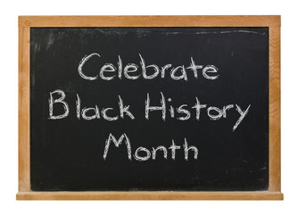 Celebrate Black History Month written in white chalk on a black chalkboard isolated on white