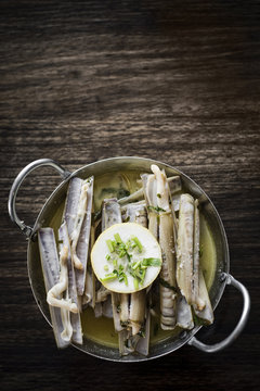 fresh razor shell seafood steamed in garlic herb wine sauce