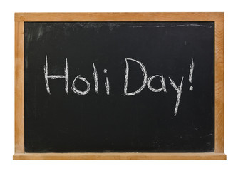 Obraz premium Holi Day written in white chalk on a black chalkboard isolated on white 