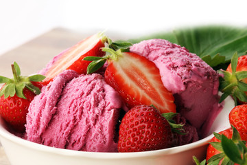 Strawberry ice cream on brown wood background