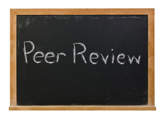 Fototapeta premium Peer Review written in white chalk on a black chalkboard isolated on white 
