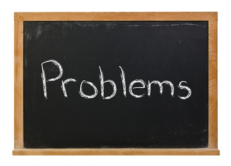 Obraz premium Problems written in white chalk on a black chalkboard isolated on white 