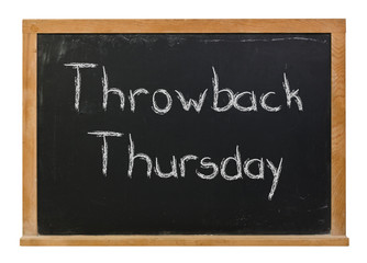 Throwback Thursday written in white chalk on a black chalkboard isolated on white