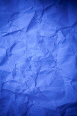 Blue crumpled paper texture background.