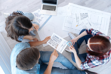 Top view of professional young architects working together