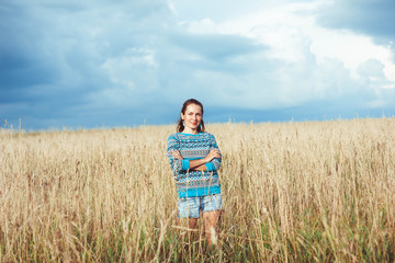 Naklejka na ściany i meble A woman in a rye field