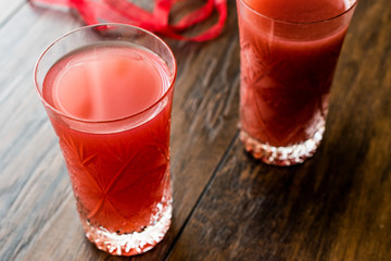 Kizilcik serbeti / Cranberry Sherbet on dark wooden surface.