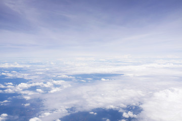 Cloudy sky from window airplane view. Nature and abstract background.