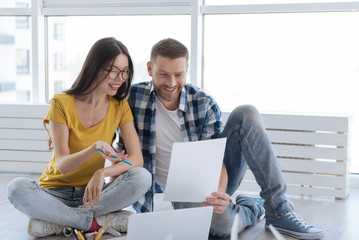 Joyful happy people discussing their business plan