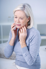 Senior woman with toothache