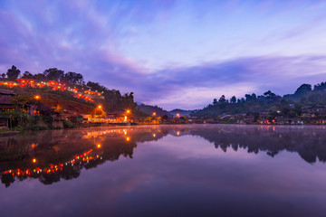 Naklejka premium Beautiful lake and sky view of the Rak Thai village and mountain reflection in Pai district, Mae Hong Son Province, Thailand.