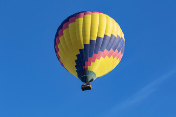 Fototapeta premium Balloon floats above California winery vineyard