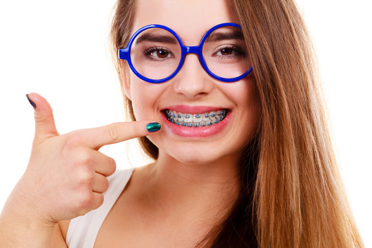 Nerdy woman showing her teeth with braces