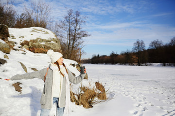 Young free girl in nature, snowy space