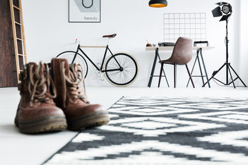 Man's boots in a room