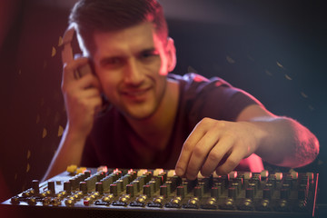 Guy using DJ console