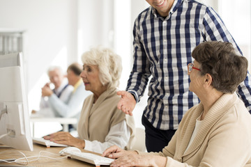 Fototapeta premium Senior lady talking to lecturer