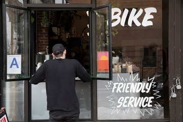 Customer at service window, Nike and Coffee shop, New York, USA
