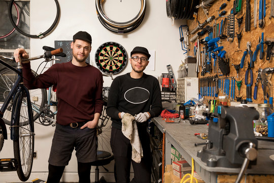 Technicians in bicycle workshop