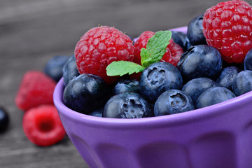 Bowl with raspberries and blueberries
