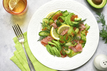 Vegetable salad with salmon and red caviar.Top view.