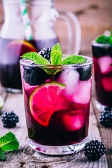 Blackberry mojito  cocktail  with lime, and mint