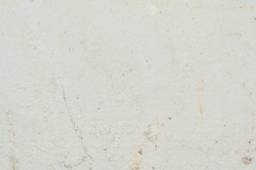 Texture of the surface of the old wall of the building, there are fractures, cracks, color divorces and salt deposits