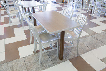 Set of modern silver wooden table and chairs