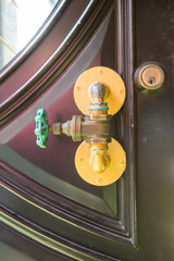 creative vintage metal door handle made from pipes and valve