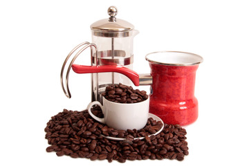 Coffee beans and a white cup on white background