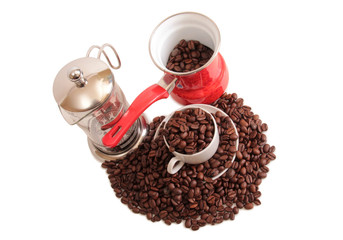 Coffee beans and a white cup on white background