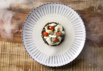 Black rice risotto with shredded cod