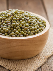 green bean cereal organic in bowl on wood background vertical vi