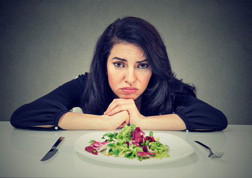 Dieting habits changes. Woman hates vegetarian diet