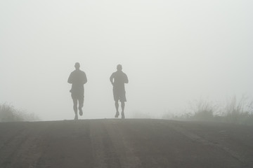runners in the mist
