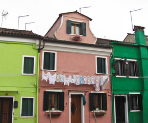 Burano, near Venice, Italy. Bright colored houses and laundry hung up to dry
