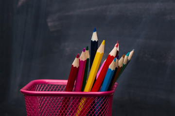 School concept. Pencils with chalkboard as background. Close up