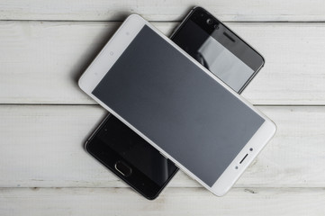 Smartphones on wooden background