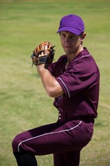 Confident baseball player playing on field