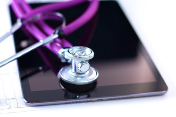 Stethoscope with a tablet computer lie on a table