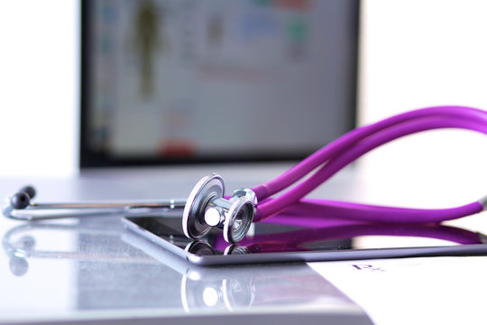 Stethoscope with a tablet computer lie on a table