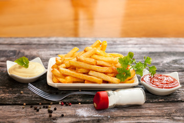 Plate with french fries and parsley