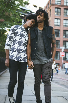 Young black gay couple walking in the street