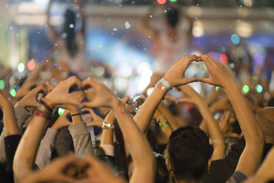 Dancing crowd at live concert, festival
