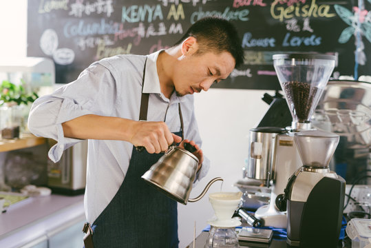 Young man preparing coffee