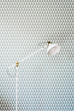 Office lamp against pattern wallpaper