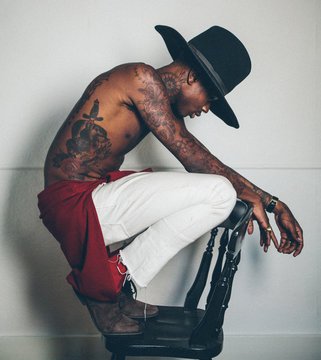Young tattooed black man modelling