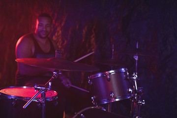 Fototapeta na wymiar Drummer performing at music concert