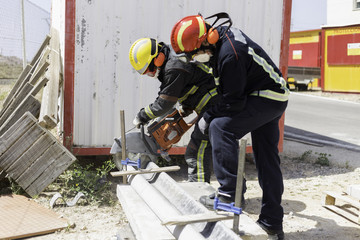 Firefighter practicing with a disc cutter